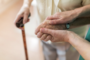 Elderly holding hands